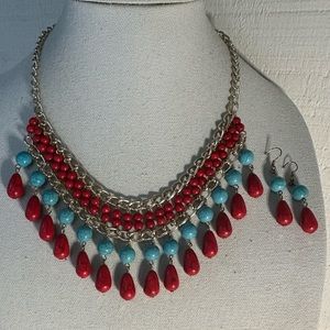 Red and turquoise colored drippy statement necklace set